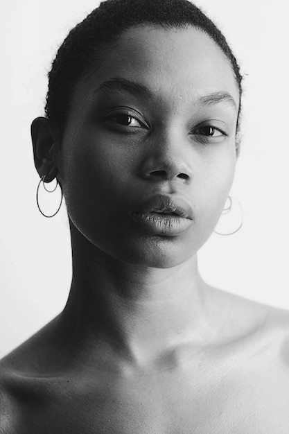 close-up portrait of young woman over white background