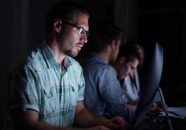 Close upbusinessman typing text on laptop