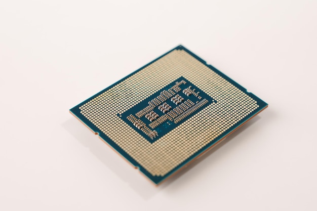 Closeup of the back of a computer processor with pins isolated on white background
