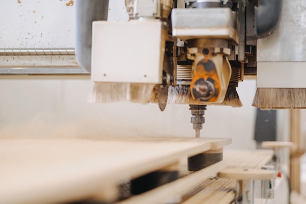 Closeup shot of a working plywood carving machine