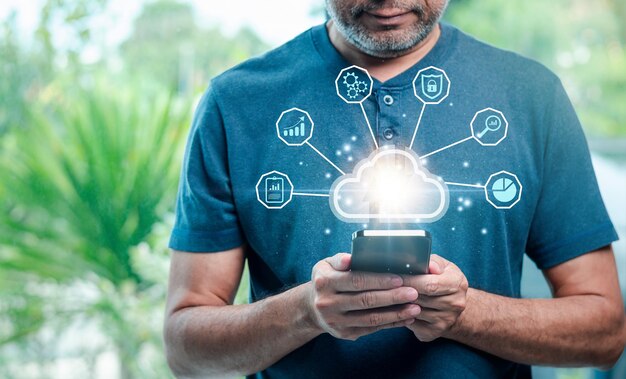 Cloud technology Data storage Networking server and backup database on internet service concept businessman uses a smartphone with a cloud computing diagram display on a virtual screen copy space