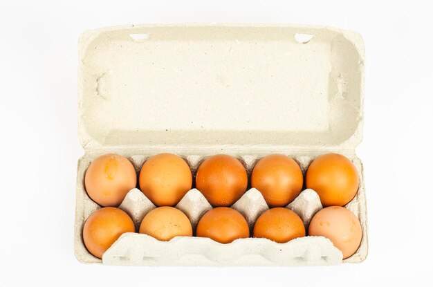 colored fresh chicken eggs in carton. studio photo.