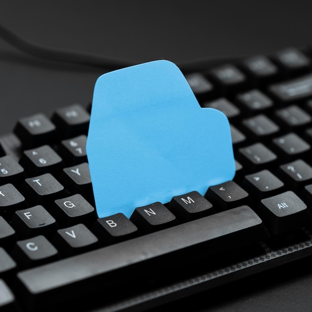 Colored sticker lying on black keyboard Important information written over paper Image with school supplies Multiple Assorted Collection Office Stationery