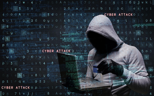 composite image of hacker using laptop to steal identity