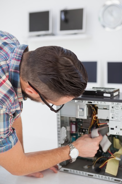 computer engineer working on broken console in his office