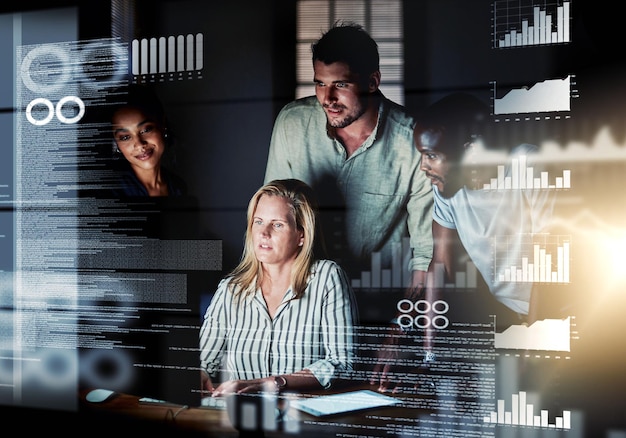 Computer engineers reading code cgi data and analyzing special effects charts while working late at night Manager and team leader helping diverse group with web developing SEO and designing website