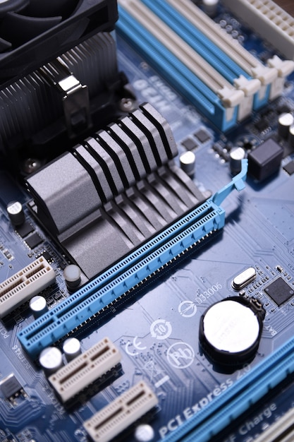Computer motherboard and electronical components cpu gpu memory and different sockets for a video card close up