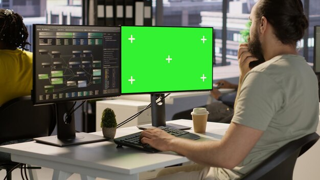 Computer scientist using isolated screen pc to create machine learning models that can process data
