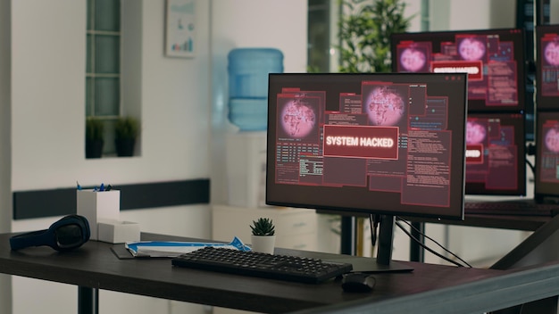 Computers displaying hacking attack alert and security breach in empty it development office. Showing critical error message flashing on screen after system crash, threat warning.