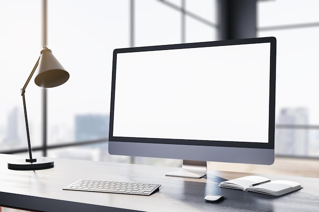 Contemporary designer table with white computer monitor coffee cup supplies other objects and window with city view in the background Mock up 3D Rendering