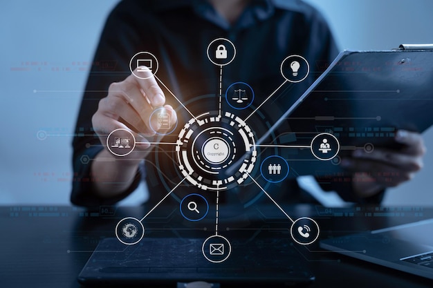 copyright or patent concept person hand using laptop computer tablet and smartphone with virtual screen copyright icon trademark creation ownership against piracy at office