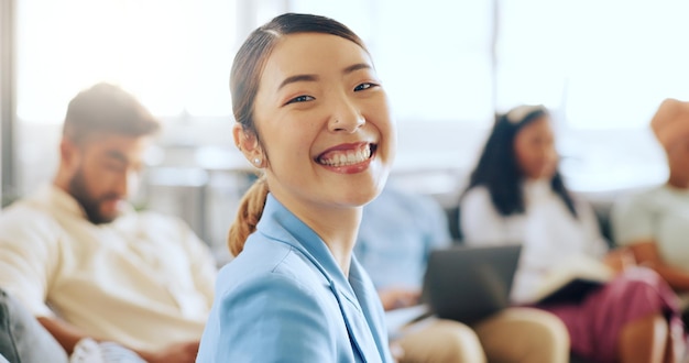 corporate woman asian and face at business meeting with smile happiness and success with team in office happy finance expert business people and portrait for vision teamwork or goals in new york