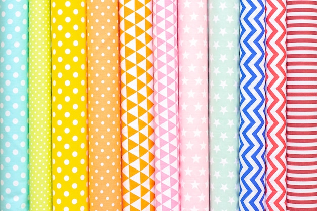 cotton light tones fabric texture. pink, orange, yellow, turquoise colors