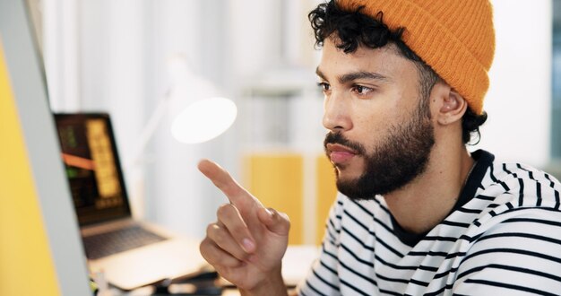 Creative web designer and man on computer pointing for software website update and user interface Digital professional and person on pc for online project graphic design and internet in office