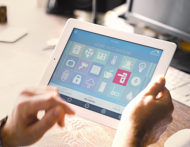 Cropped hand holding digital tablet