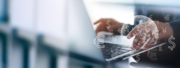 Currency exchange money transfer FinTech financial technology Global business online banking interbank payment concept Man using mobile phone and laptop computer with international currencies