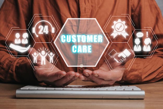 Customer service and care concept Person hand holding customer care icon on virtual screen