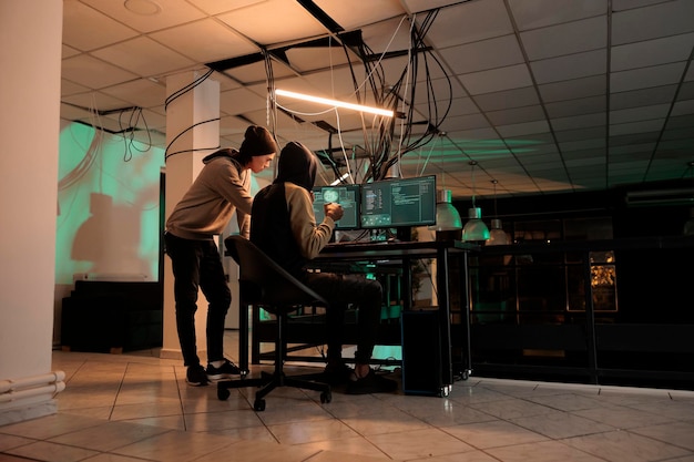 Cyber security specialists fixing computer system cyberattack, developer coding antivirus program. Diverse coders programming app, cybersecurity technology, database server protection