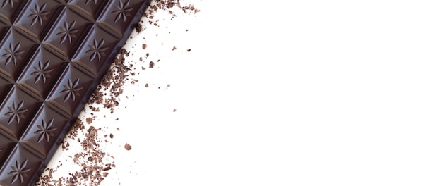 Dark chocolate bar with shavings top view isolated on white surface