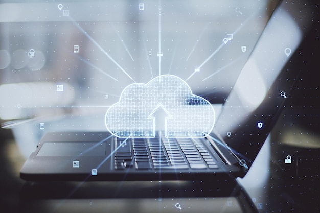 Data and information storage concept with digital cloud technology sign with arrow inside on modern laptop background double exposure