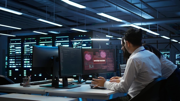 Data center cybersecurity division teamworking colleagues fighting virus