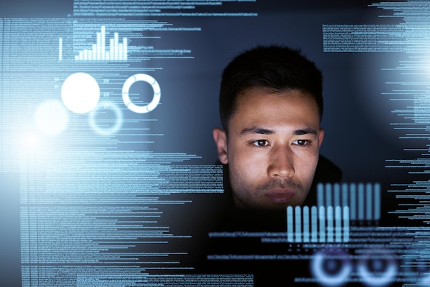 Data programmer and man with focus hologram or cyber security with website information futuristic or night Male person hacker or coder with overlay analytics or holographic with cloud computing