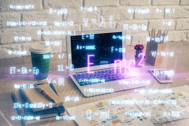 Desktop computer background and formula hologram writing Double exposure Education concept