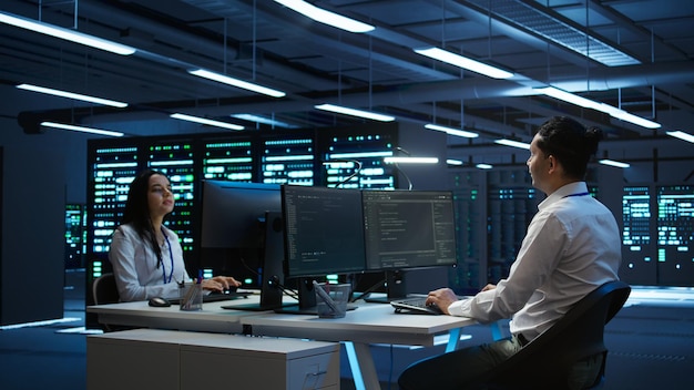Developer and coworker overseeing data center