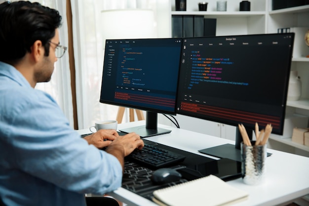 Developer working software development coding two computer code screen Surmise