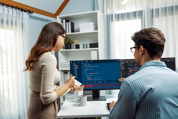 Developers program coding discussing website planning software Postulate