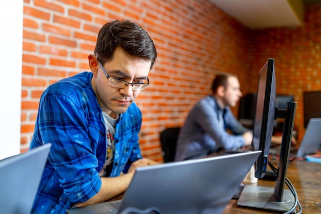 Developing programming and coding technologies Website design Programmer working in a software develop company office