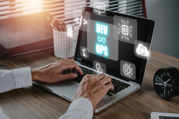 devops concept woman hand using laptop computer with devops icon on vr screen on desk methodology development operations agil programming technology concept