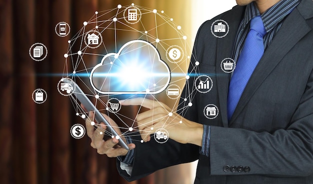 digital composite image of businessman using digital tablet