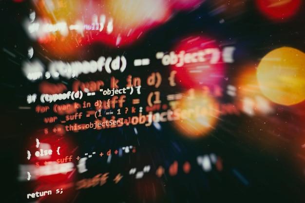 digital technology on display. html5 in editor for website development. website html code on the laptop display closeup photo.