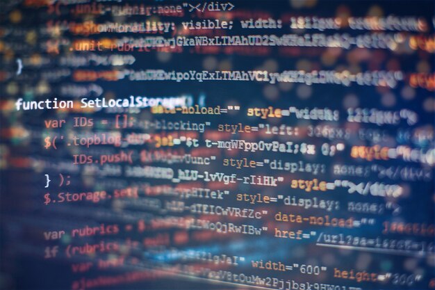 Digital technology on display. HTML5 in editor for website development. Website HTML Code on the Laptop Display Closeup Photo.