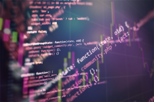 digital technology on display. html5 in editor for website development. website html code on the laptop display closeup photo.