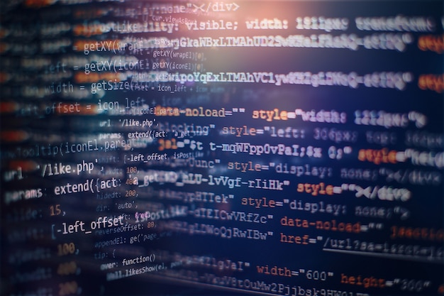 Digital technology on display. HTML5 in editor for website development. Website HTML Code on the Laptop Display Closeup Photo.