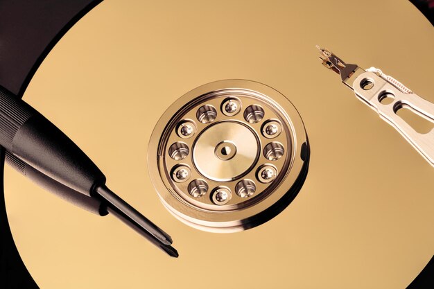 Disassembled hard drive from the computer hdd with mirror effect Opened hard drive from the computer hdd with mirror effects data recovery concept