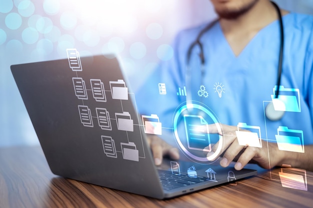 doctor using computer document management system dms online documentation database process automation to efficiently manage files