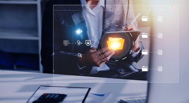 Document management system concept business man holding folder and document icon software searching and managing files online document database for efficient archiving and company data