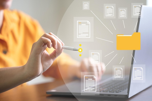 document management system concept business man holding folder and document icon software