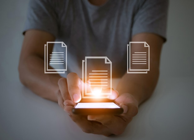 document management system dmsconcept a man with a smartphone social and a touch screen monitor