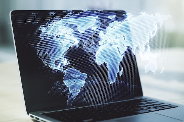 double exposure of abstract digital world map on laptop background research and strategy concept
