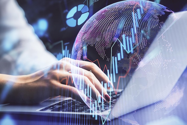 Double exposure of businesswoman hands typing on computer and forex chart hologram drawing Financial analysis concept