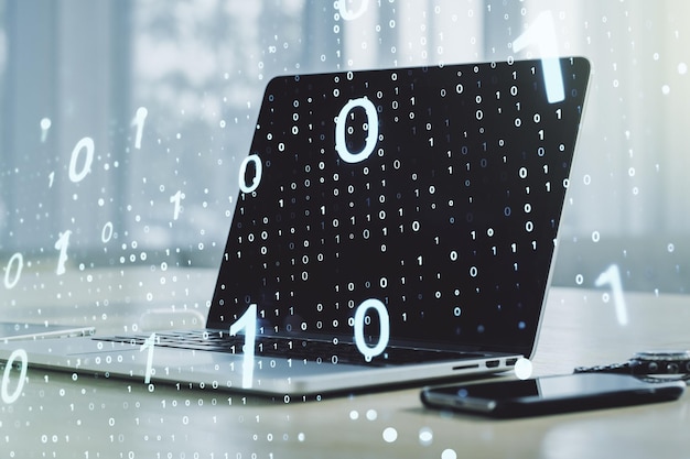 Double exposure of creative abstract binary code hologram on laptop background Database and programming concept