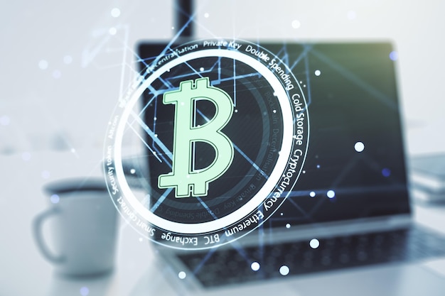 Double exposure of creative Bitcoin symbol hologram with computer on background Mining and blockchain concept
