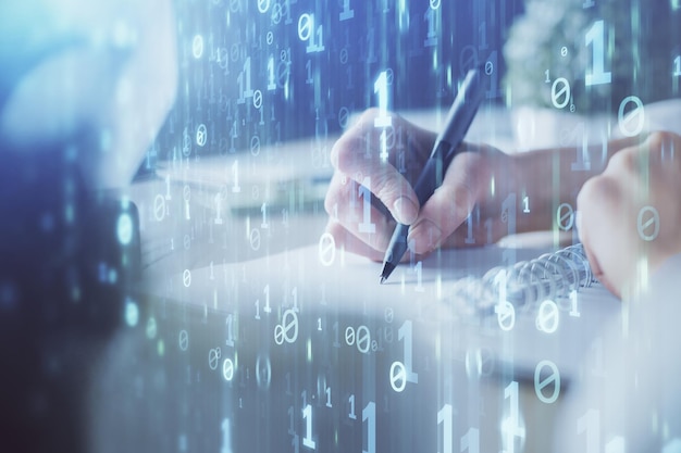Double exposure of hands making notes background with technology and digital coding huds Data learning concept