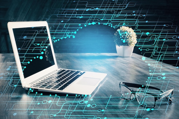 Double exposure of laptop computer and technology theme hologram Concept of freelance work