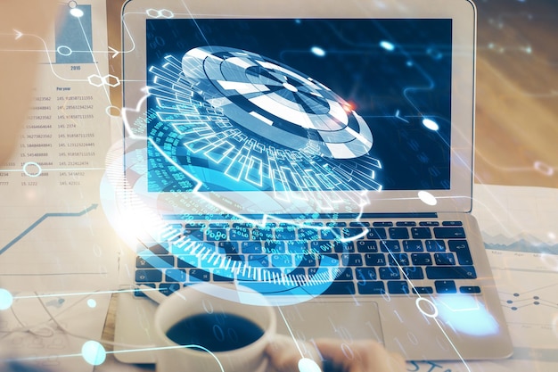 Double exposure of laptop computer and technology theme hologram Concept of freelance work