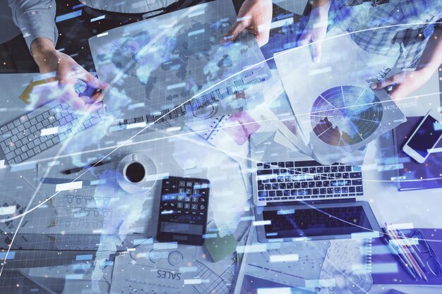 double exposure of man and woman working together and data theme hologram drawing computer background top view